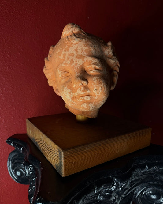 Head of a Child Terracotta on Wooden Base