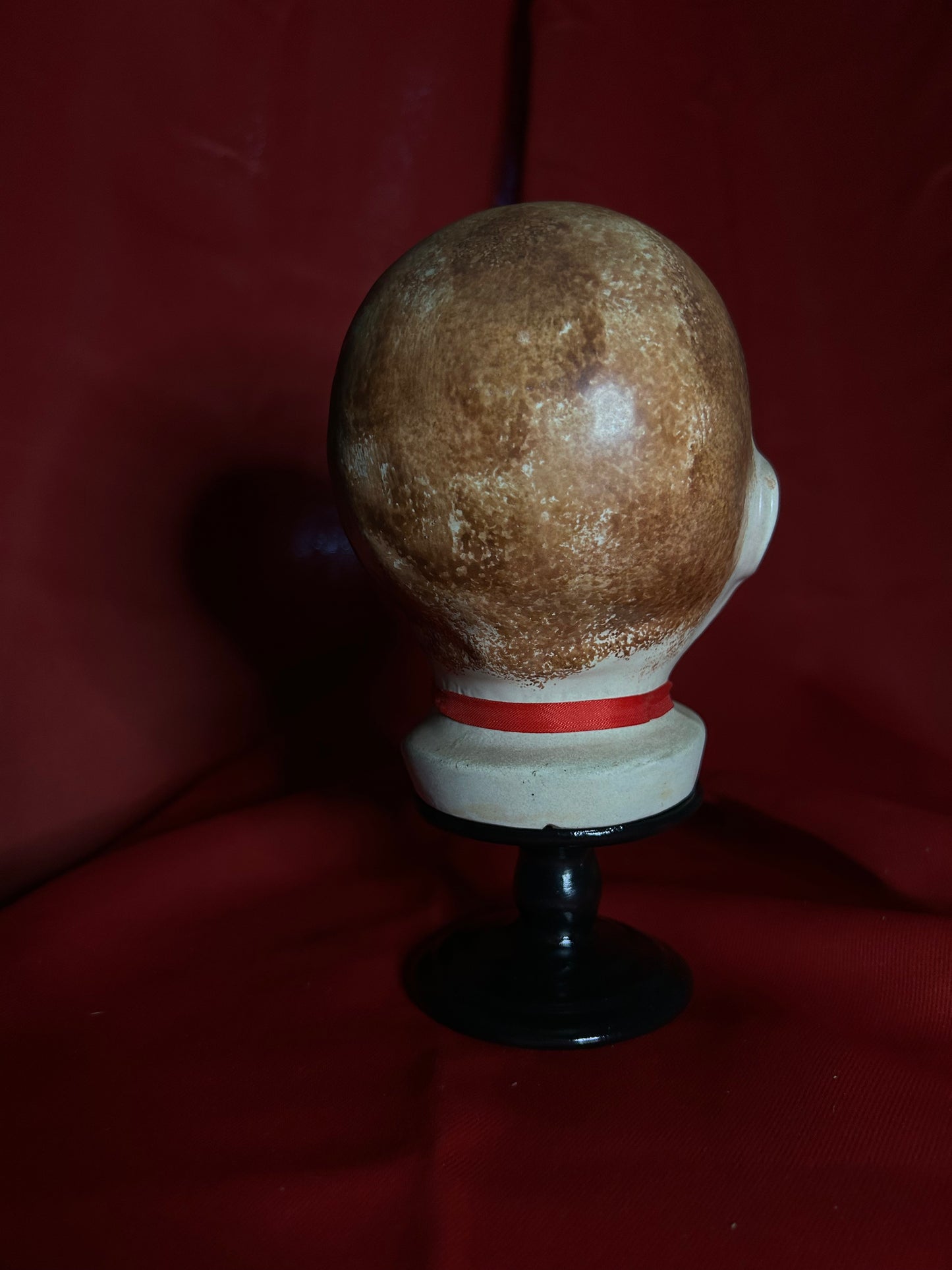 Doll Head Red Ribbon