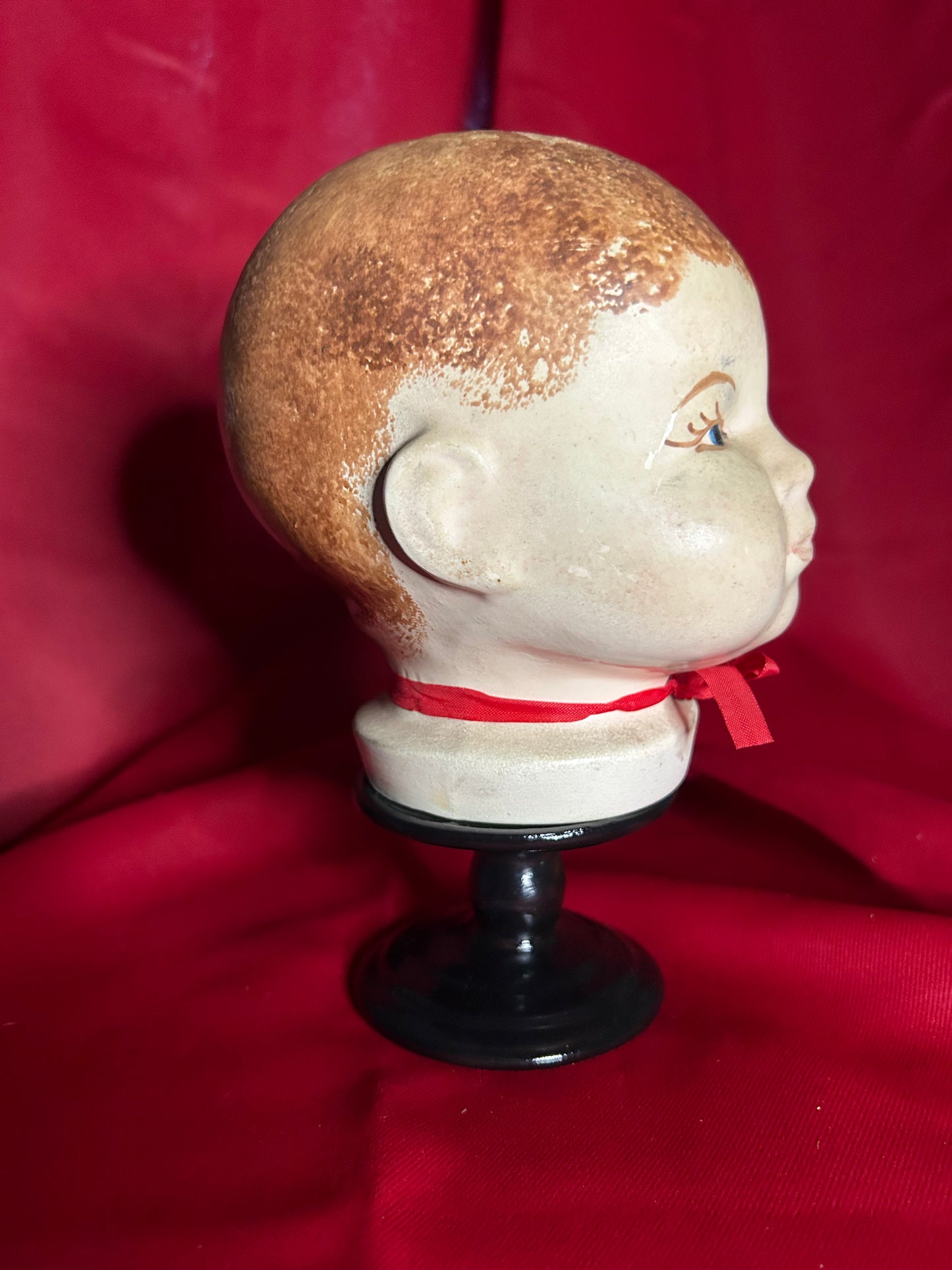 Doll Head Red Ribbon
