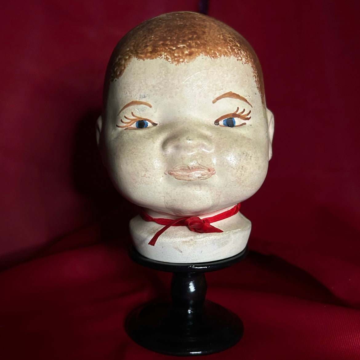 Doll Head Red Ribbon