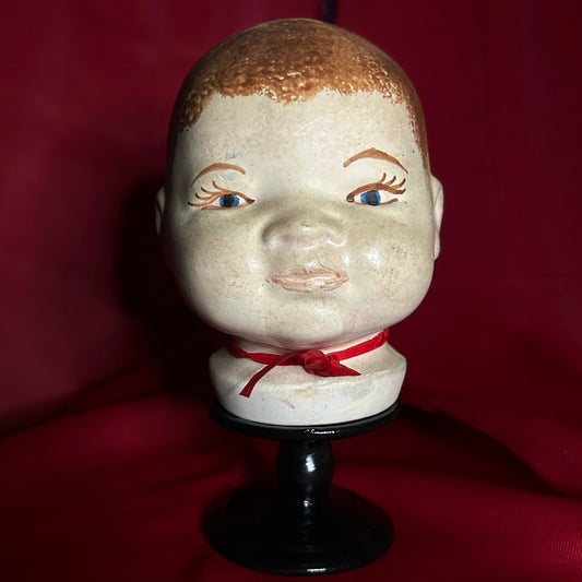 Doll Head Red Ribbon
