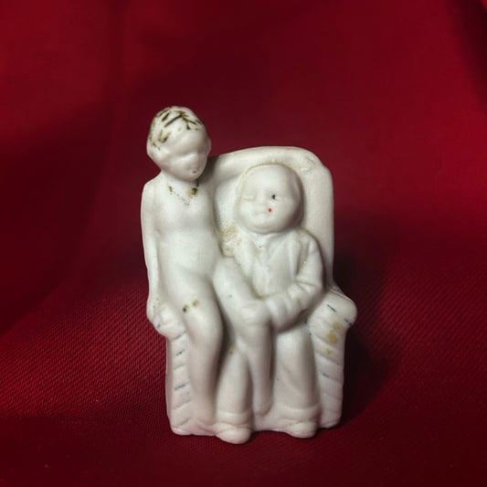 Lady Sitting in Mans Lap